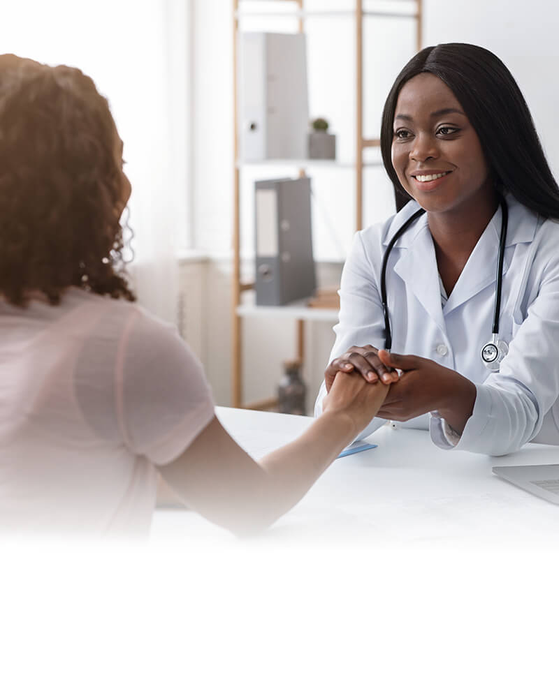 Black women doctor holding hands of patients