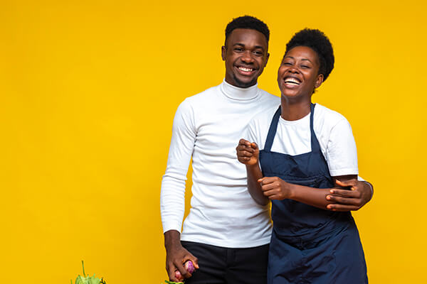 Image of young black couple smiling together